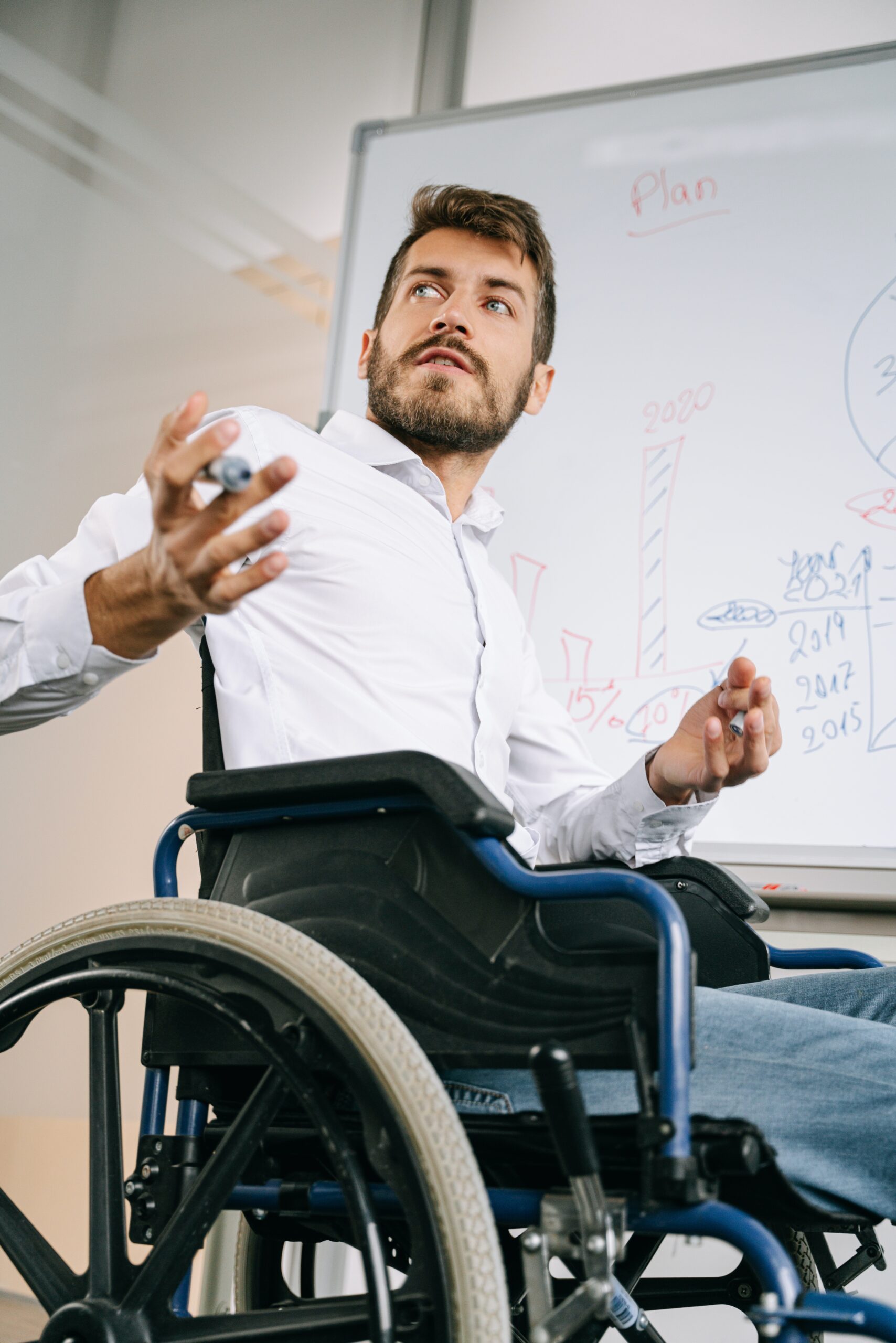 Teacher on Wheel Chair Solving Maths