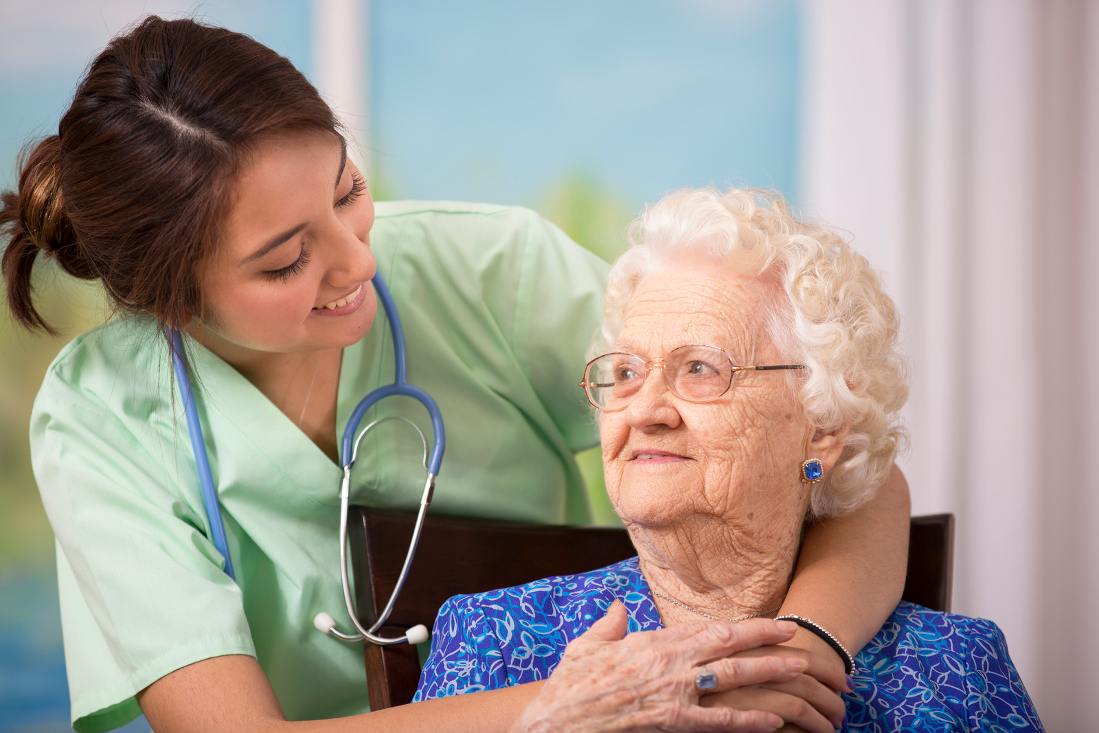 Nurse helping old lady